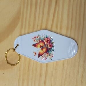 Orange butterfly with flowers white key chain